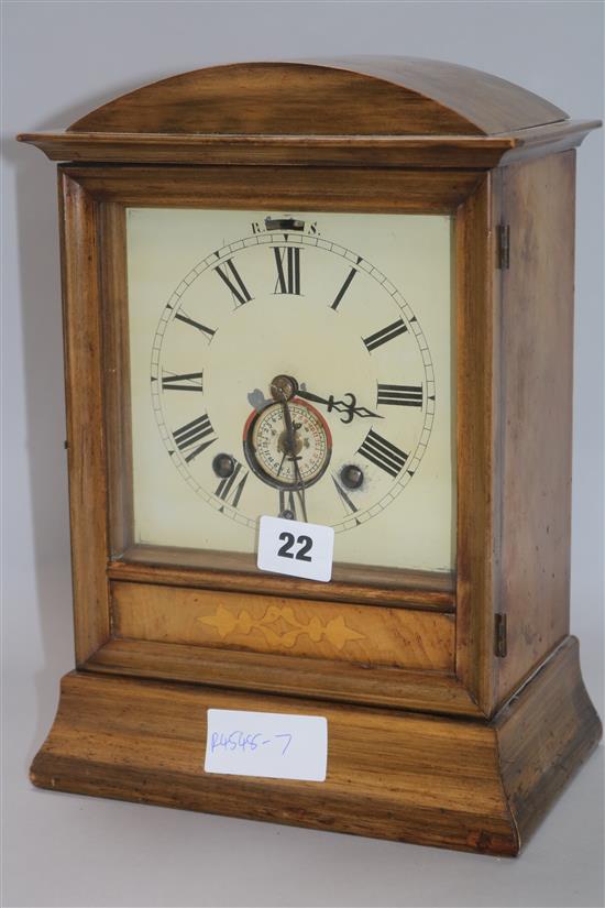 A walnut mantel clock H.30cm.